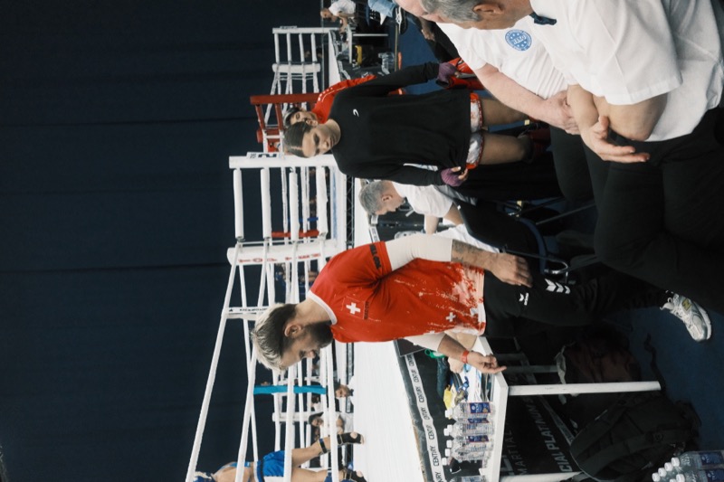 Eva Tschanz walking to the ring with her coach