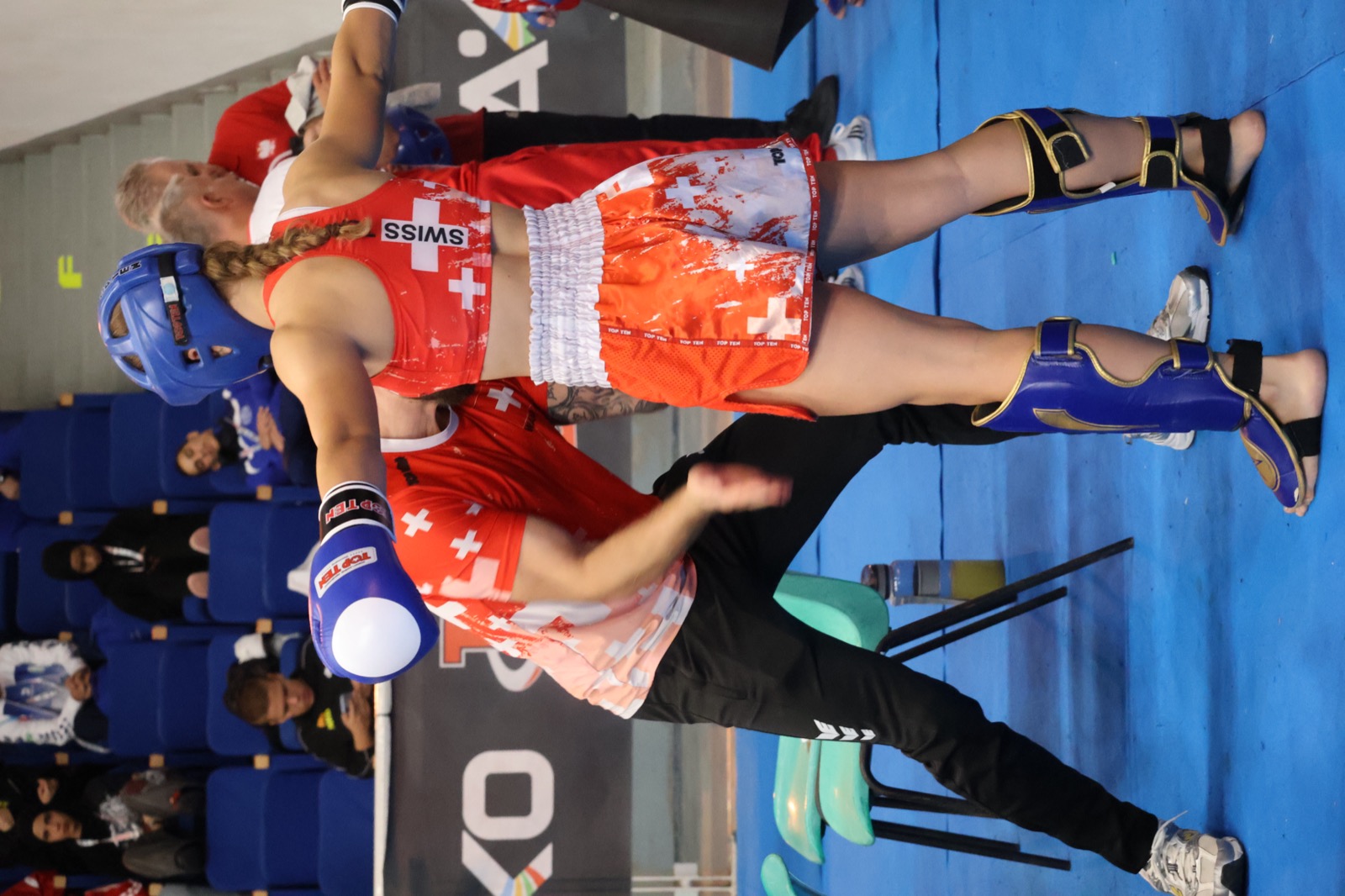 Eva Tschanz throwing a jab in a K1 fight